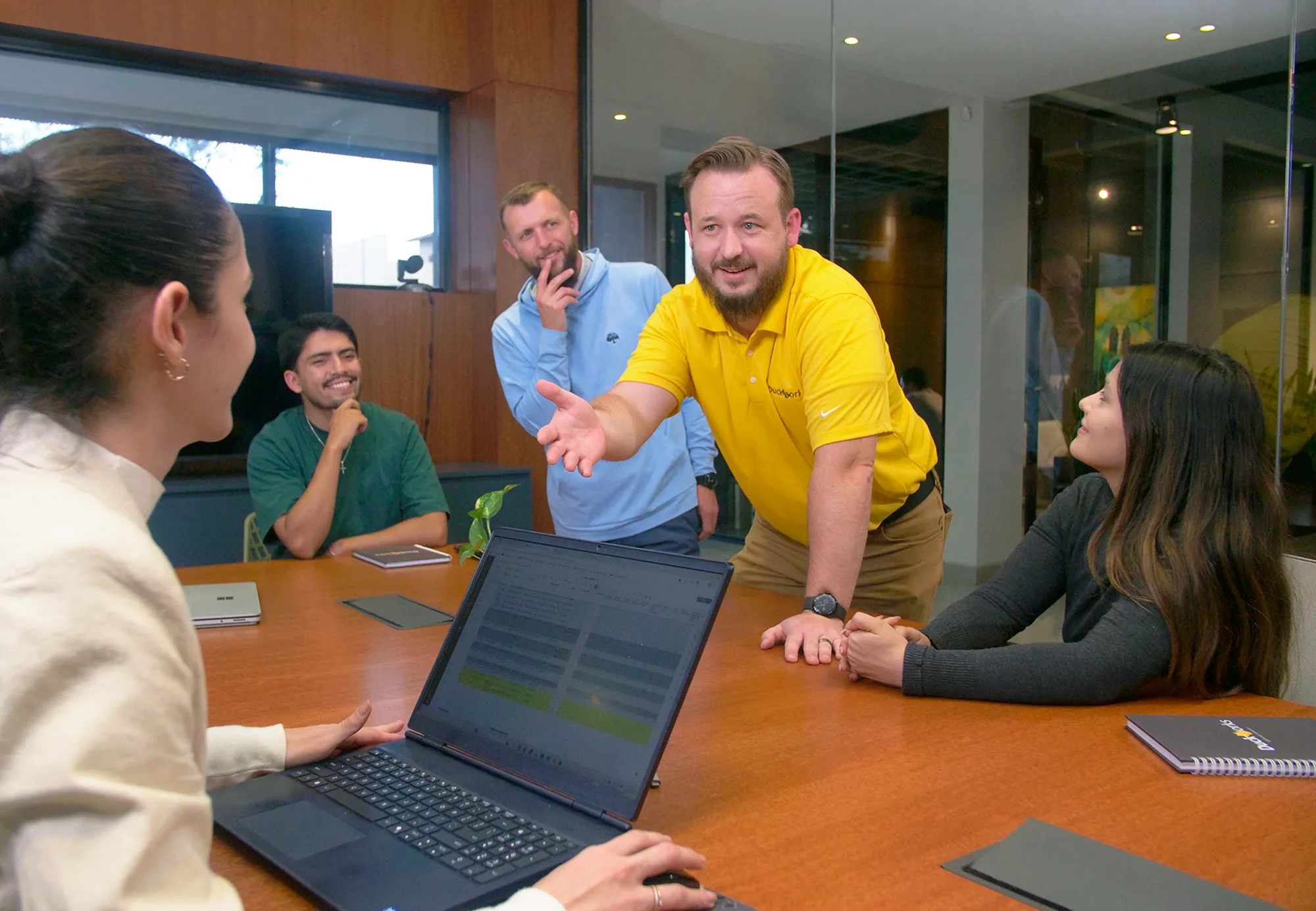 DuckWorks team reviewing drawings with a client
